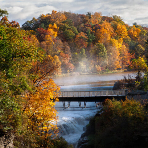 Beebe Lake and the Triphammer Foot Bridge in fall.