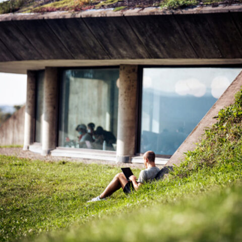 A student finds a quiet place to study outside Uris Library.