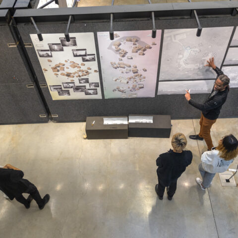 Students in the College of Architecture, Art and Planning go through a critique in Milstein Hall.