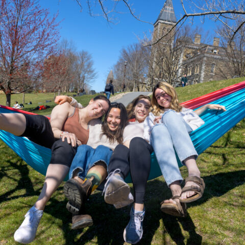 Students relax on the slope on a warm spring day