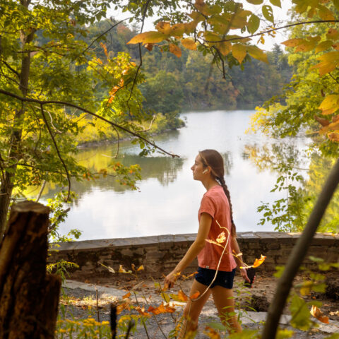 A student walks the trails around Beebe Lake.