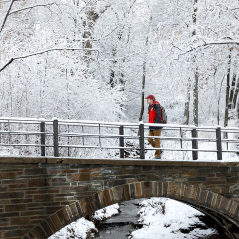 Student make their way to class in the snow on the first day of spring semester.