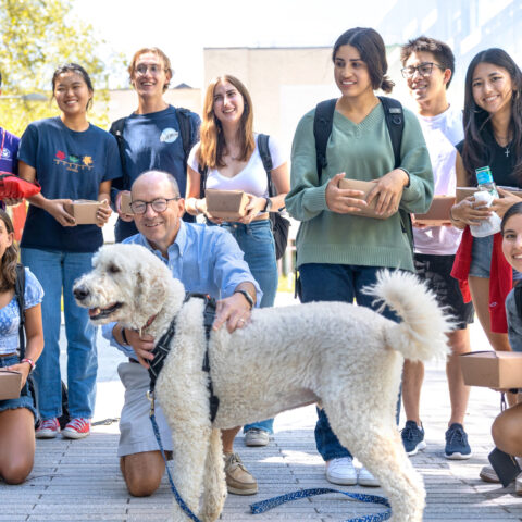 Sean Nicholson, director of the Sloan Program in Health Administration, holds outdoor office hours for Brooks School freshmen with his dogs Boomer and Madison at the start of the 2022 fall term.Professor Sean Nicholson, Director of the Sloan Program in Health Administration, holds outdoor office hours for Brooks School freshmen with his dogs Boomer and Madison at the start of the 2022 fall term. In addition to meeting the dogs, students were able to discuss questions with Professor Nicholson and enjoy cookies and cinnamon rolls.