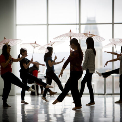 Students practice dance steps.