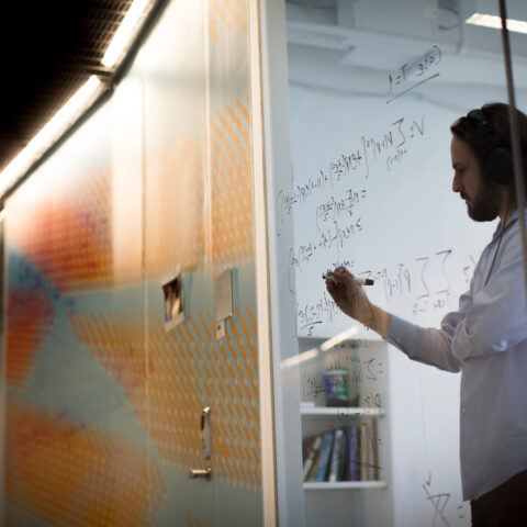 A graduate student in Computing and Information Sciences (CIS) works on formulas.