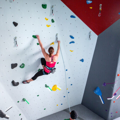 A student climbs the Lindseth Climbing Wall.